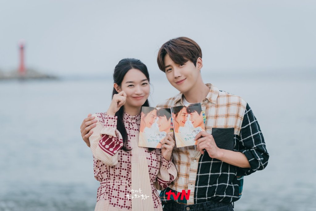 Shin Min-a and Kim Seon-ho standing together in seaside village drama Hometown Cha-Cha-Cha.